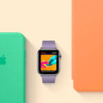 Foto de um iPhone com capa cor hortelã um Apple Watch com pulseira Lilás e um iPad com capa frontal laranja